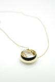 Laus pendant in 14 carat gold set with natural round cut quartz