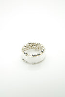 Hringur Ring by Orr is composed of a strong silver band set with countless round, pure silver units on the inside